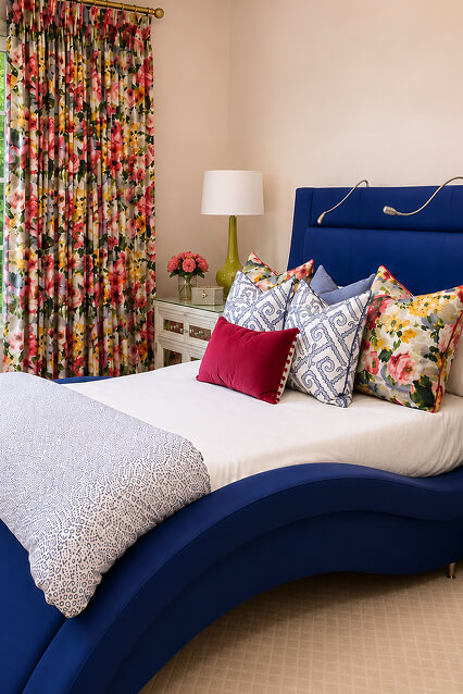 A modern bedroom blue upholstered bed
